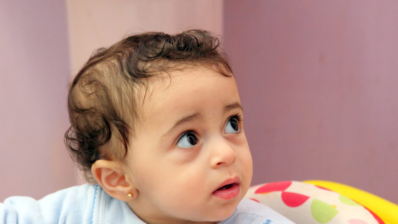 A curious toddler looking up