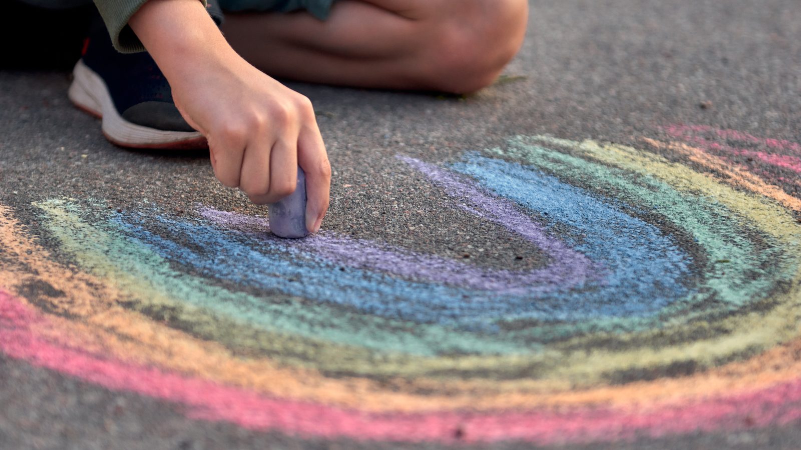 Hand drawing with coloured chalk on the ground