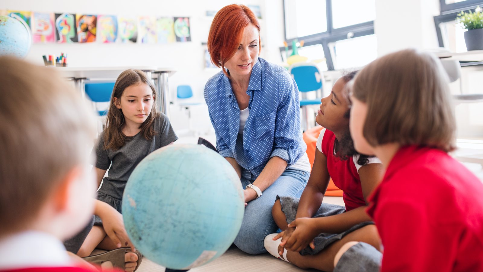 A teacher leading a small-group activity