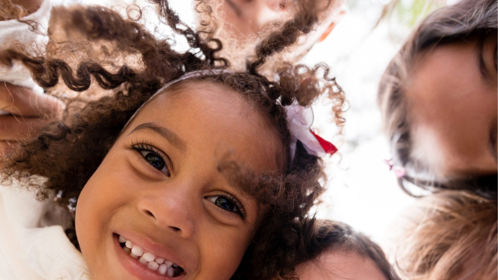 Happy preschool friends smiling together