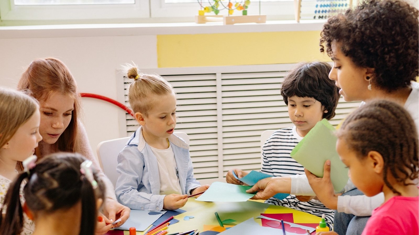 Preschool children doing an activity at a round table