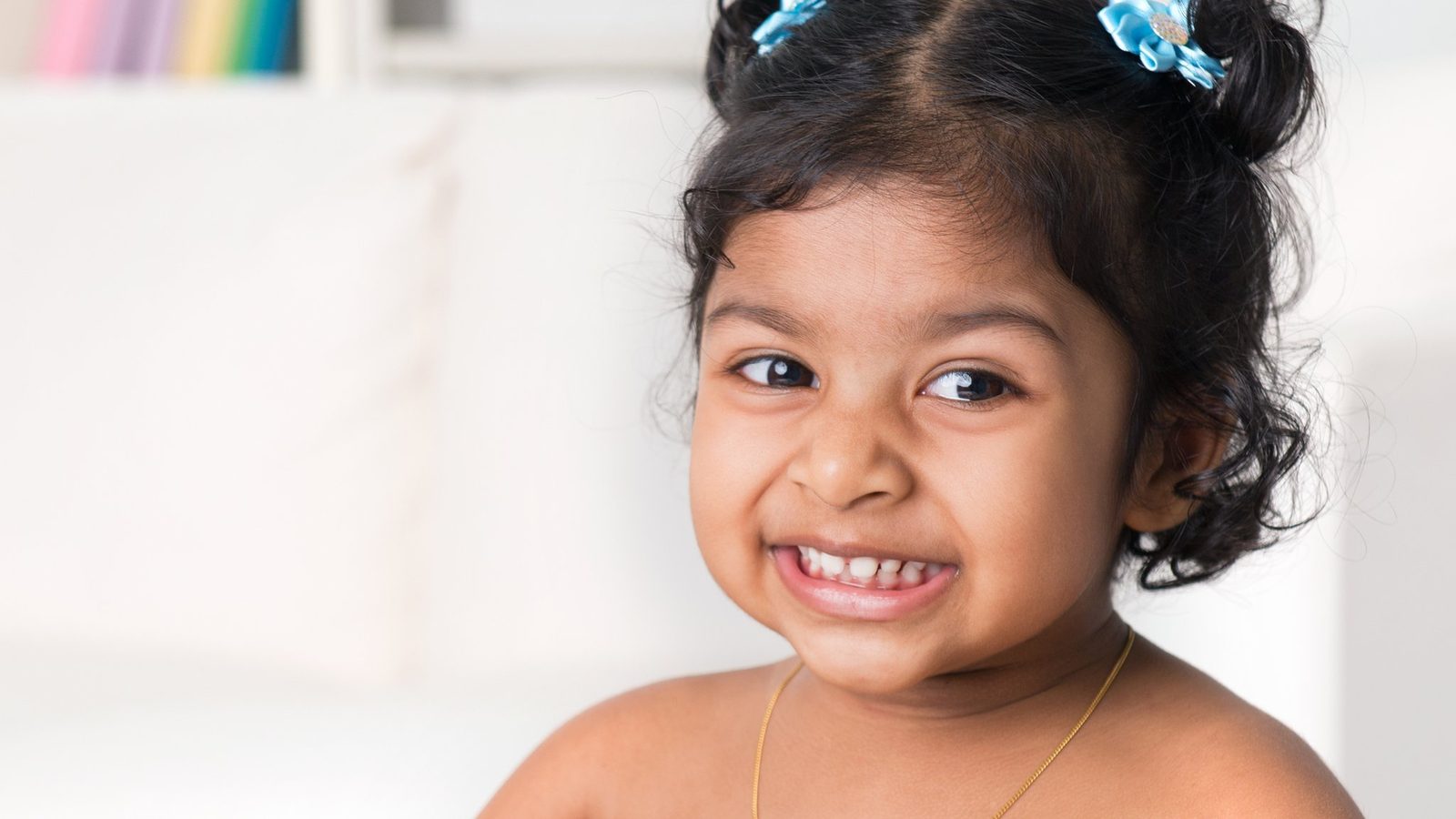 Smiling girl with pigtails