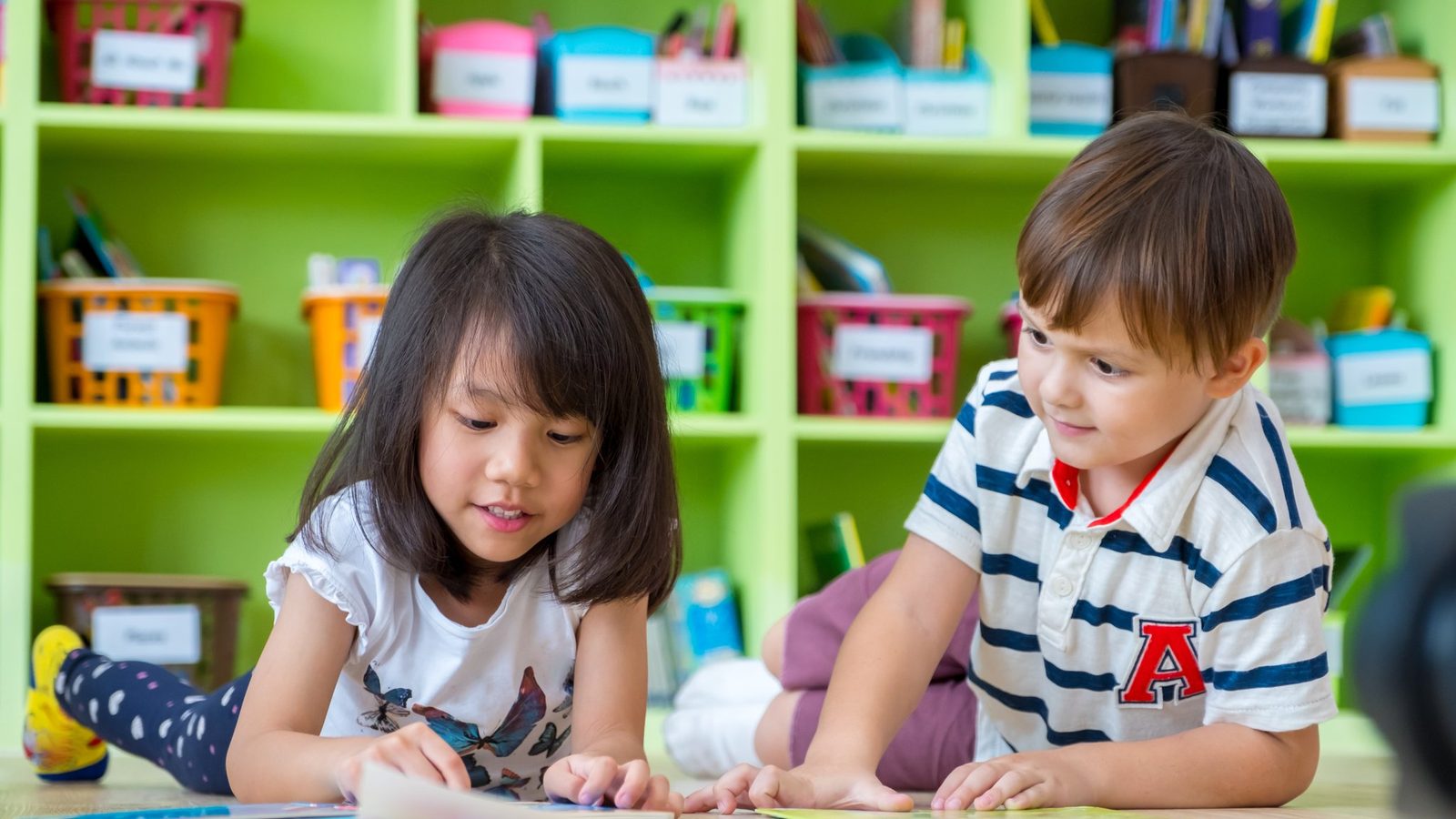 Children drawing together in a kindergarten classroom
