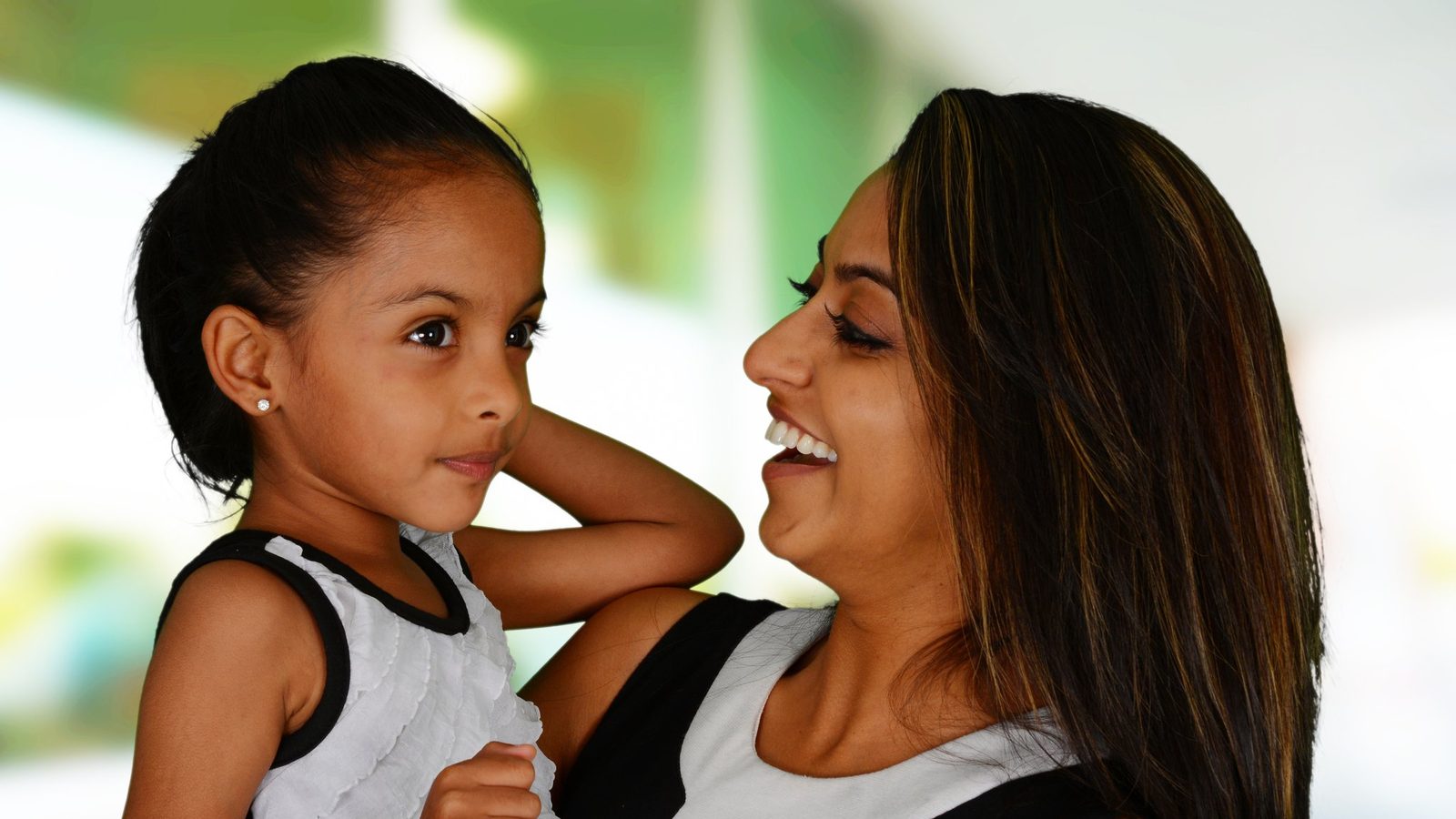 Mother and daughter laughing together