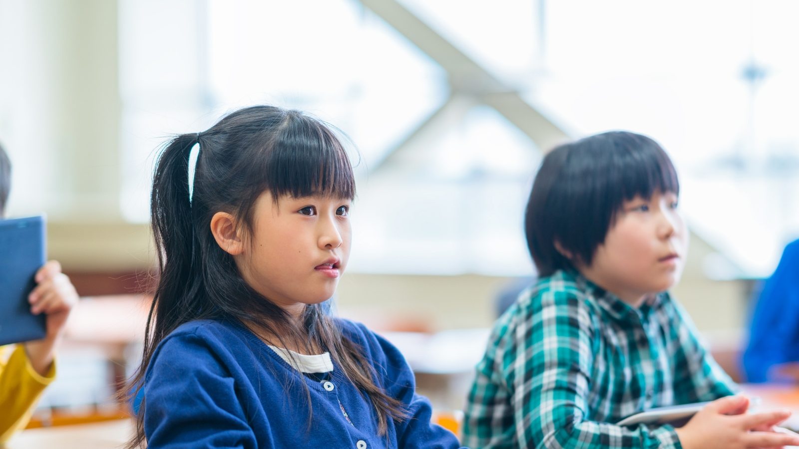 Children concentrating on an activity at their desks