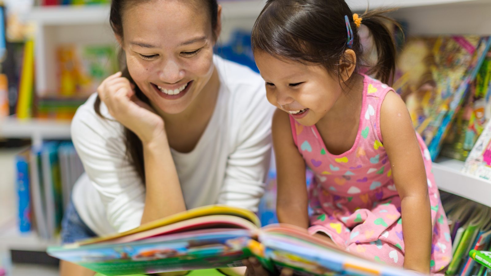 A mother and daughter reading together