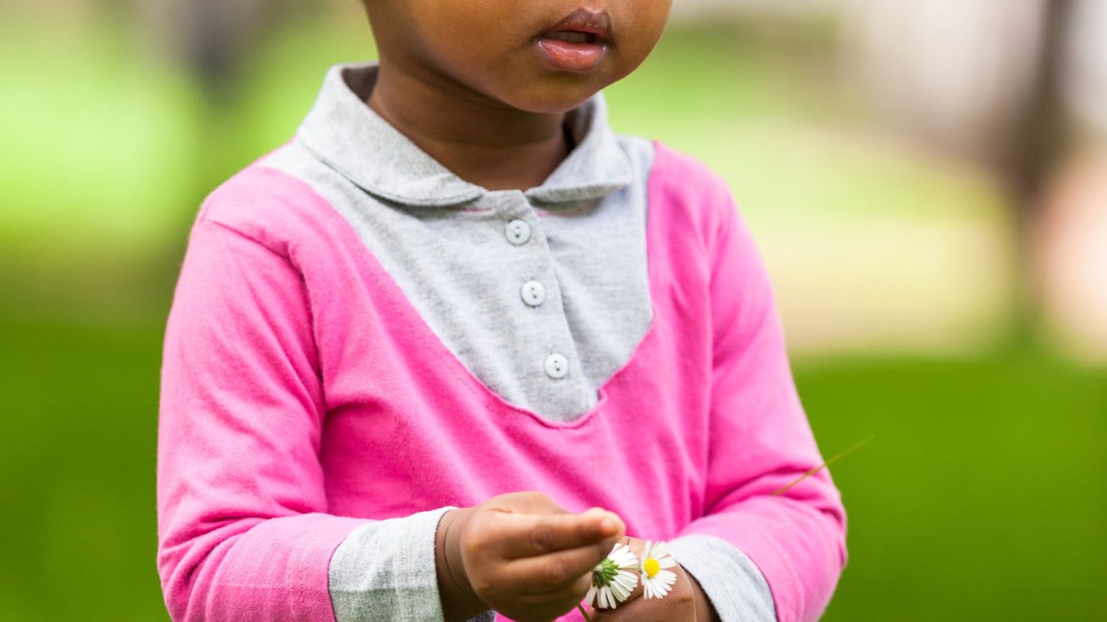 Young girl standing outdoors