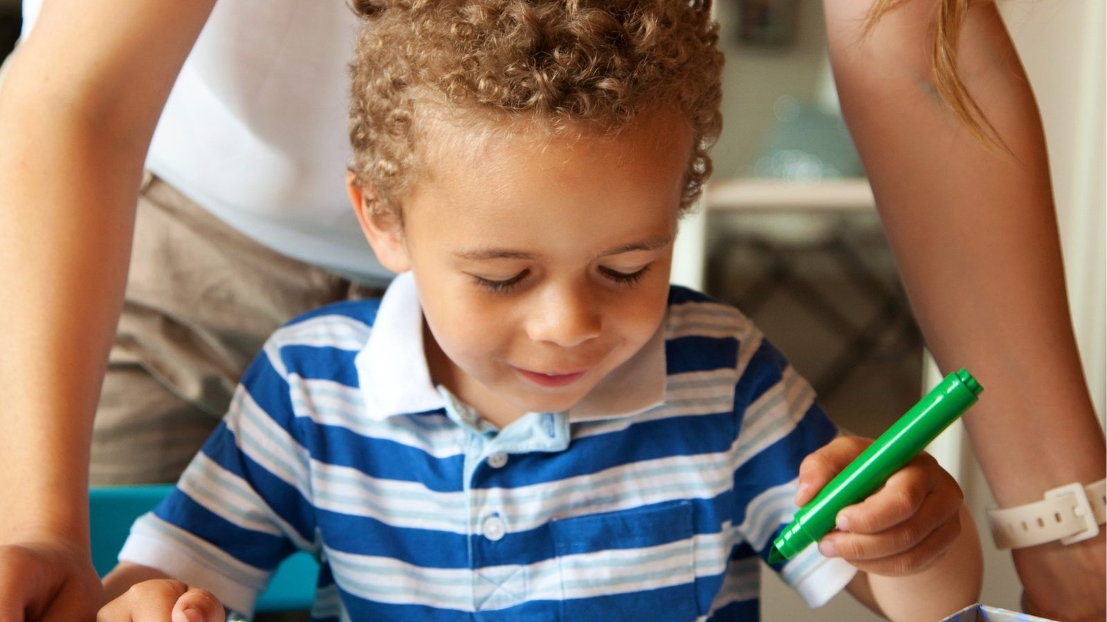 A mother and son drawing together