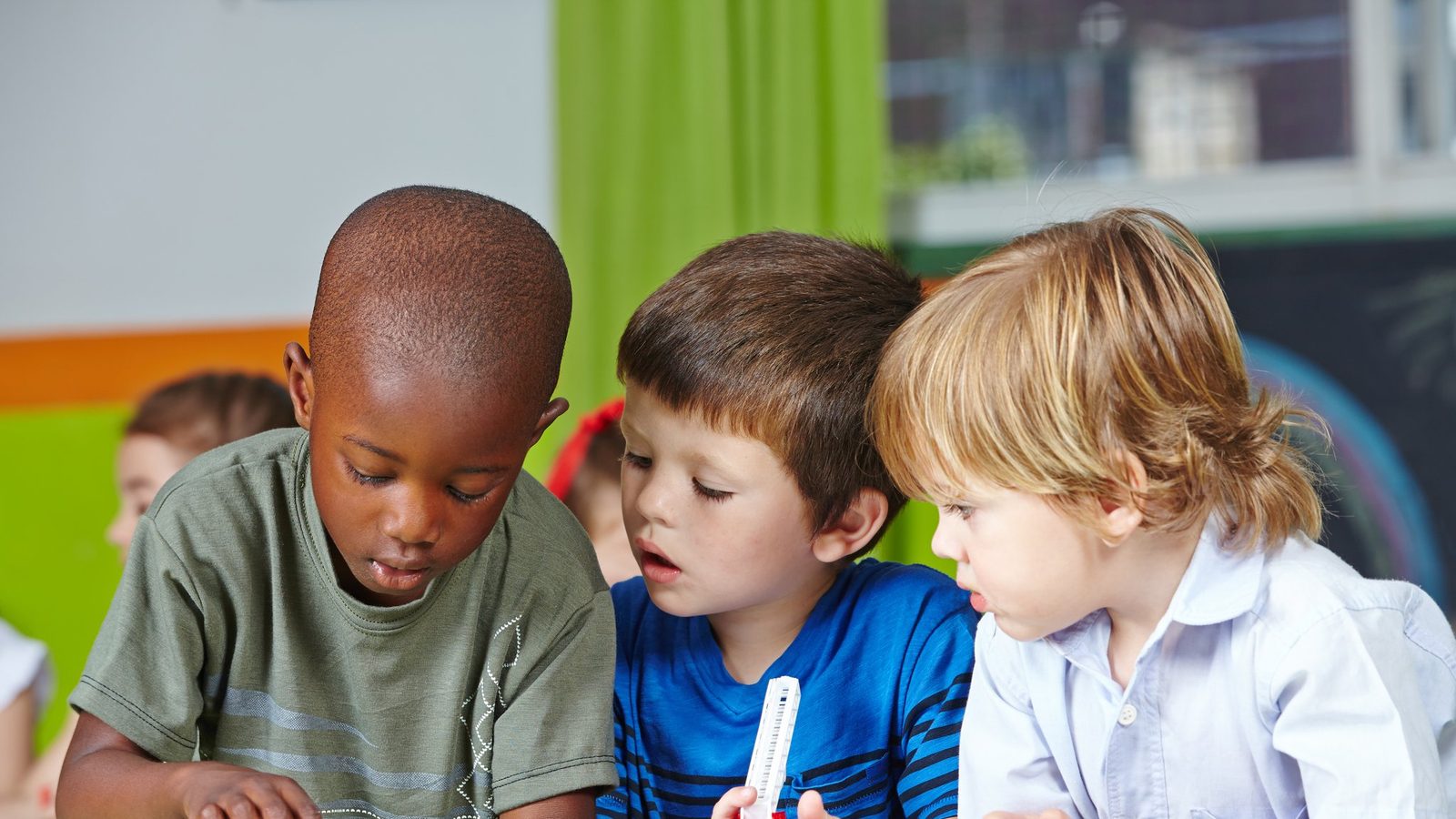 Boys working on an activity together