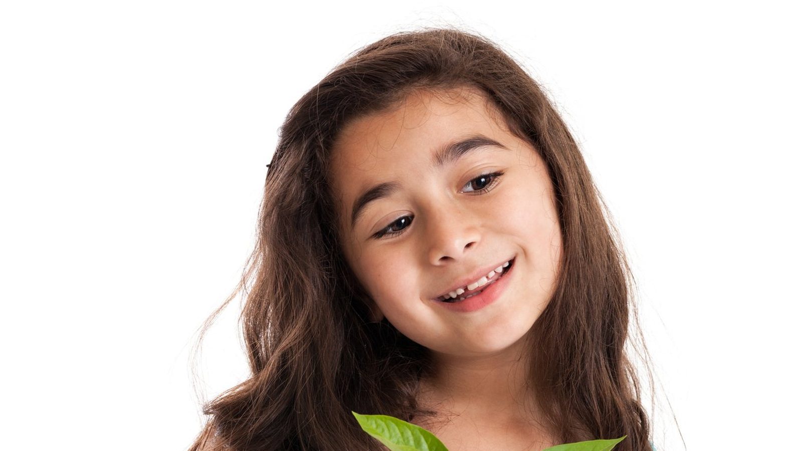 A smiling girl in a blue dress
