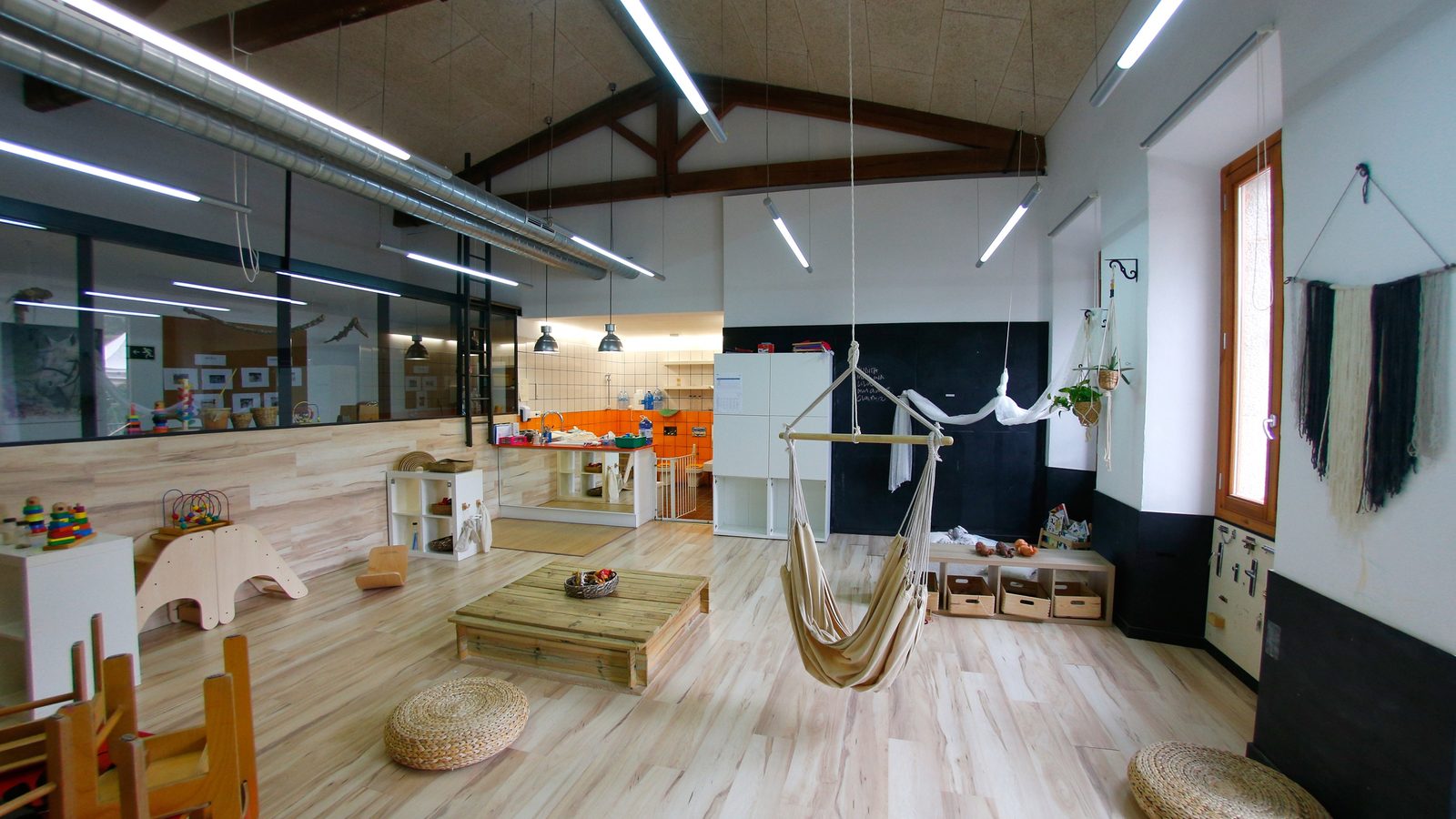 Empty open-plan learning space with wooden floor