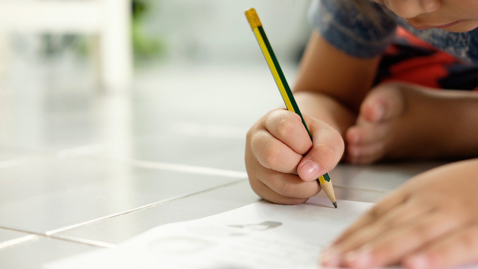 Child's hand drawing with a pencil