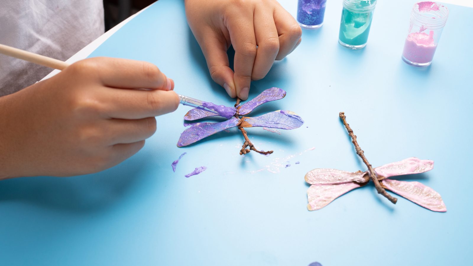 Hand painting a dragonfly
