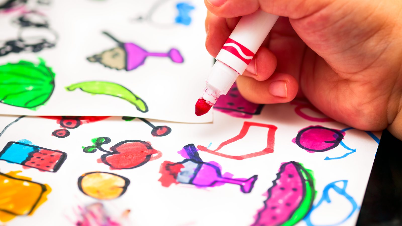 Hand drawing colourful pictures with a marker