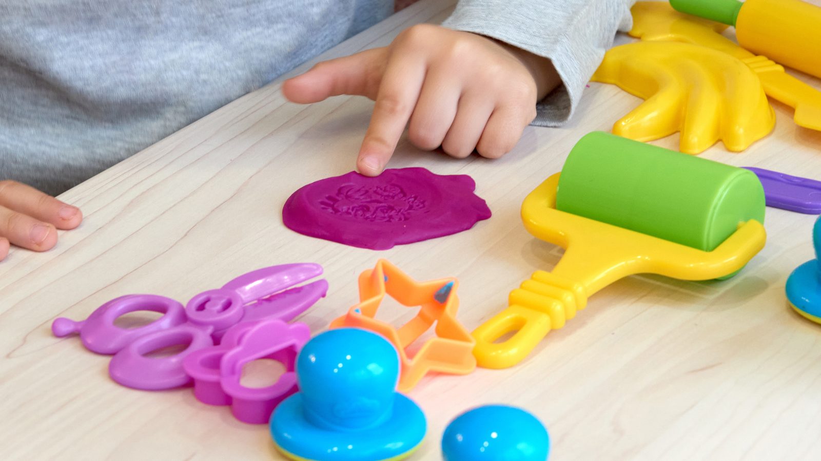 Play dough and modelling tools on a table